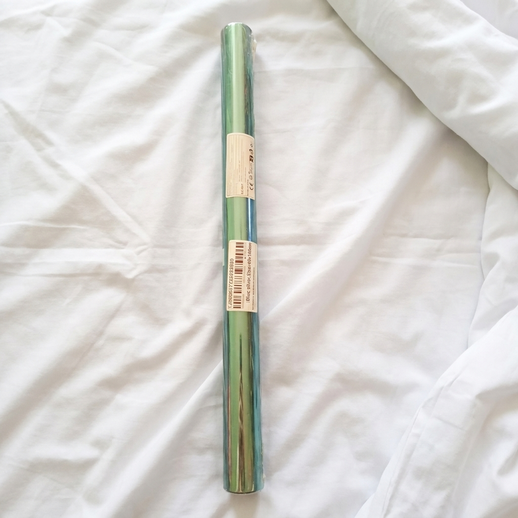 Sealed privacy film roll laid out before installation